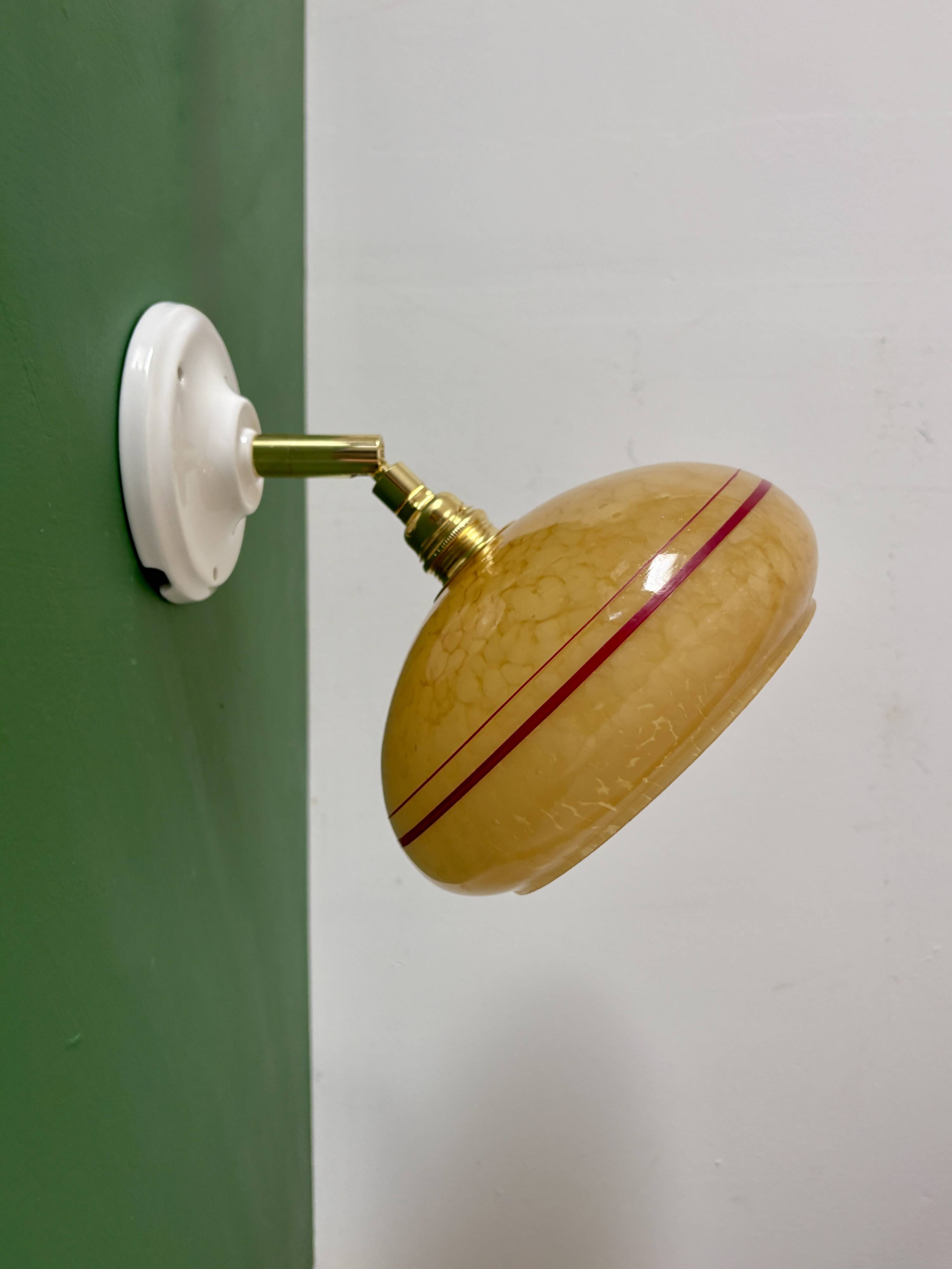 Vintage wall lamp with yellow clichy glass shade and red trim