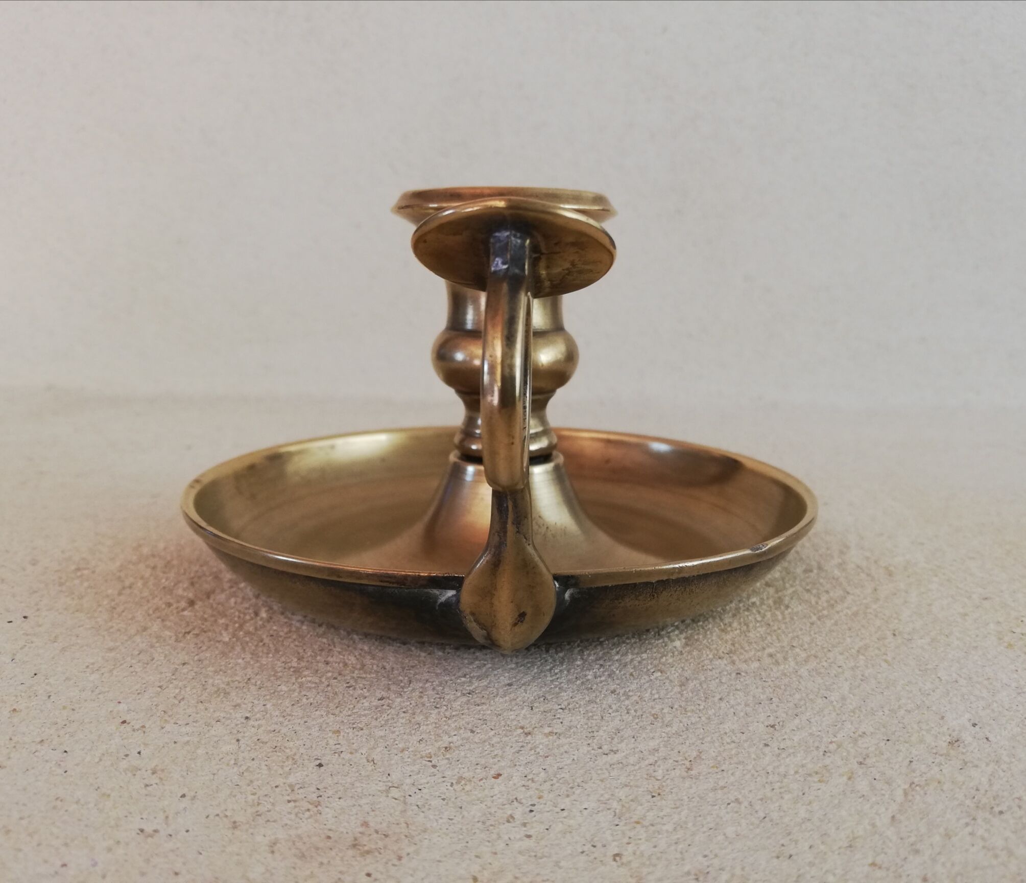 Brass hand candle holder