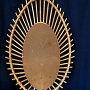 Oval shaped sun mirror in vintage rattan 1960/1970