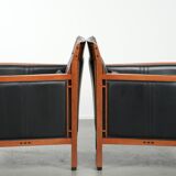 Set of 2 black leather Art Deco design armchairs in good condition