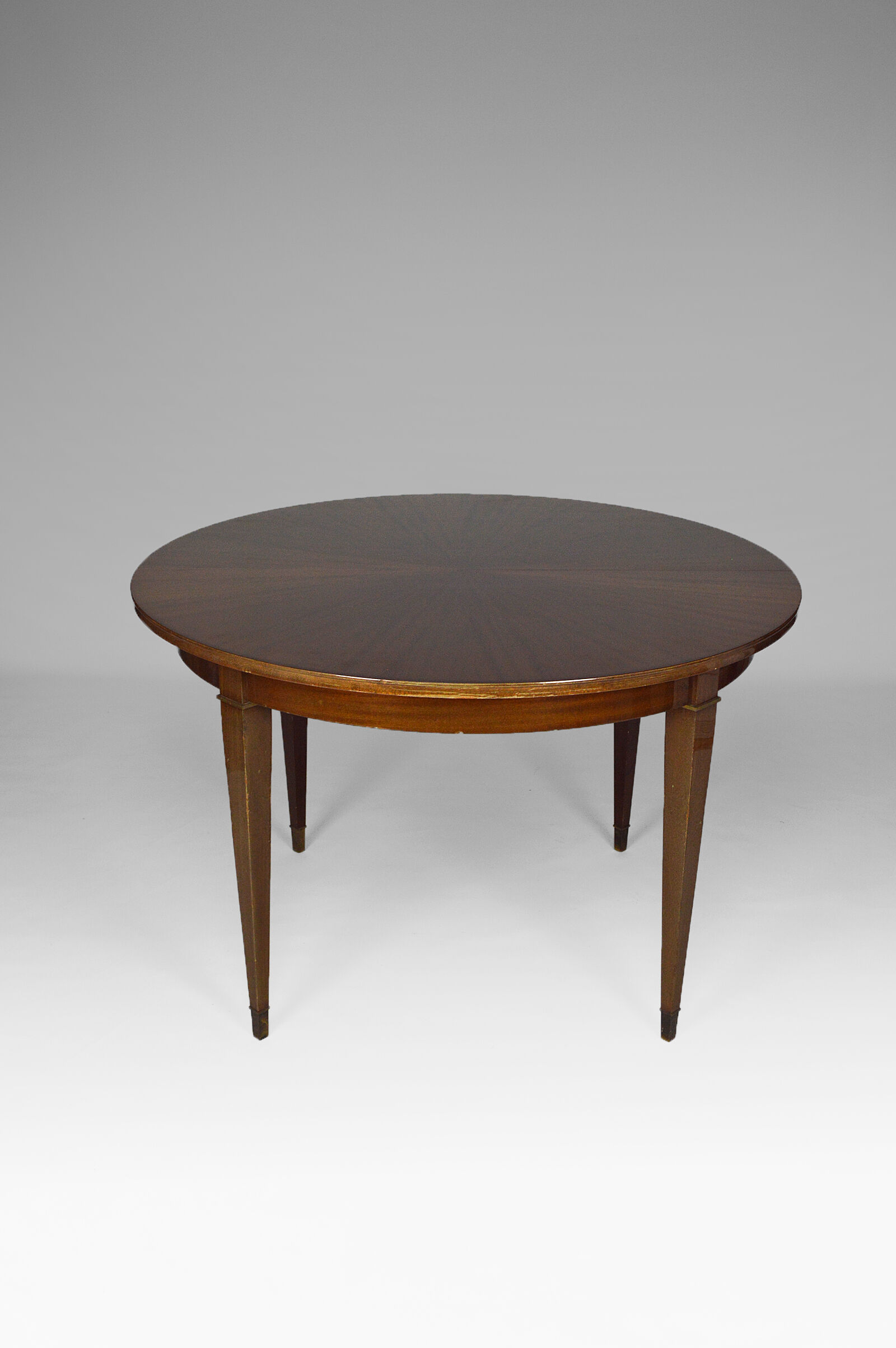 Art Deco mahogany round table by Jacques Adnet around 1940
