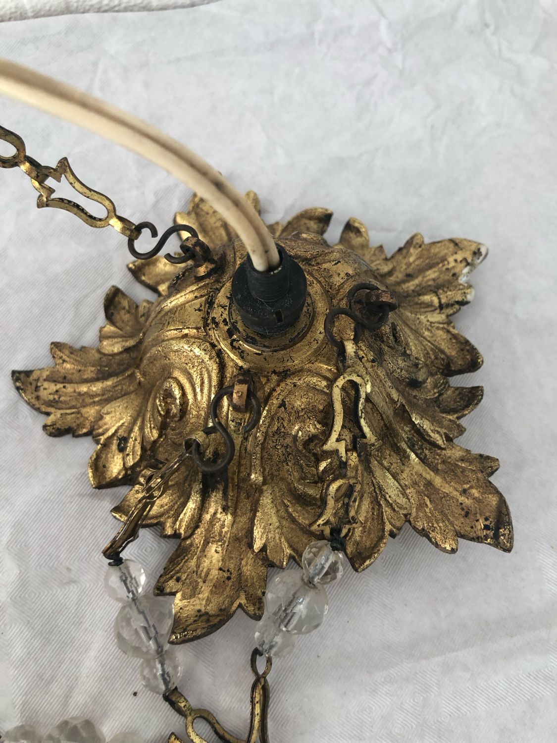 Vintage tassel chandelier has 2 glass and brass crowns