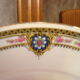 6 flat porcelain plates, "B.F Limoges" garlands of roses and geometric frieze, lot 1.