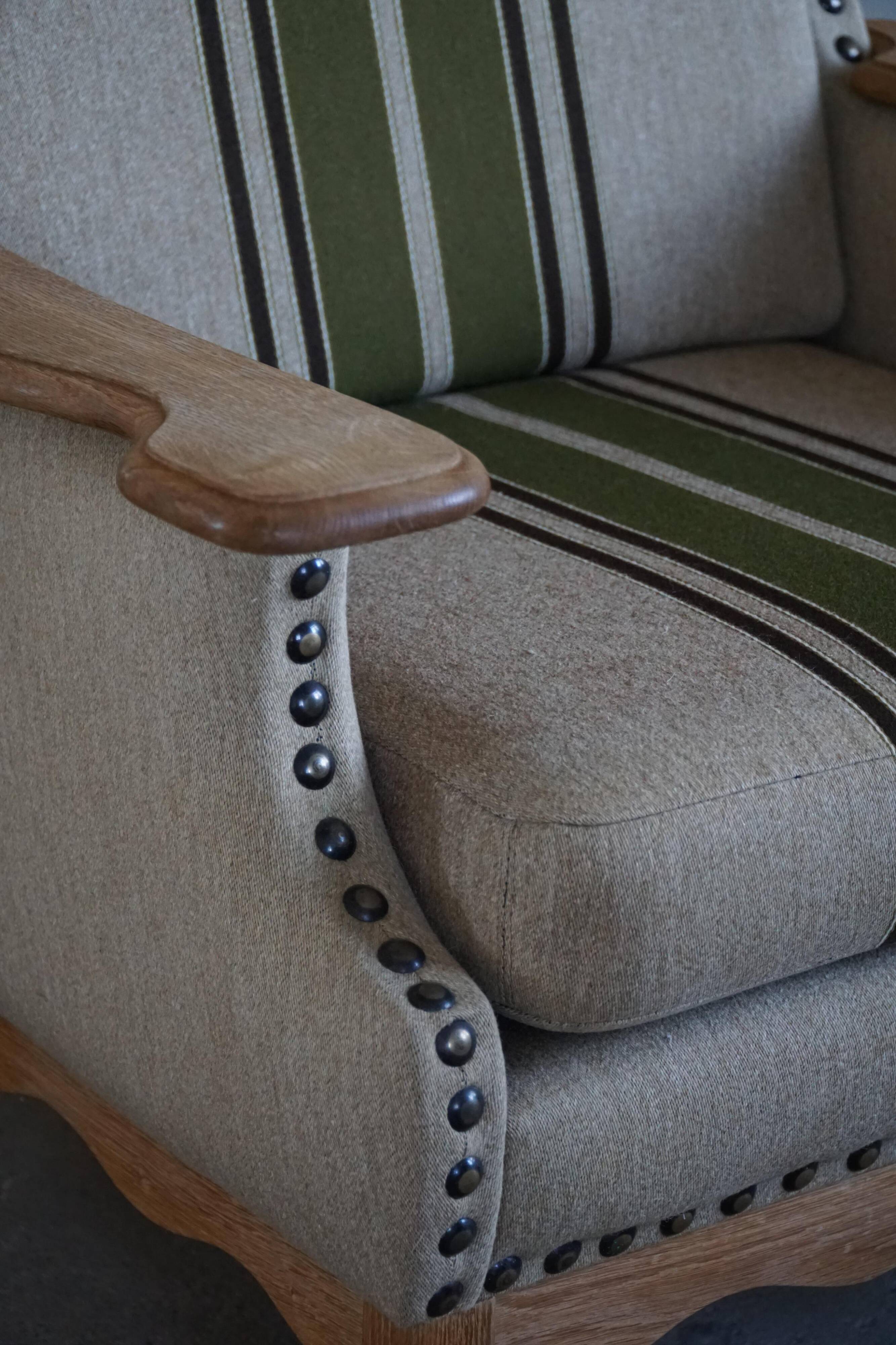 Pair of high-back lounge chairs in modern Danish style in the manner of Henning Kjærnulf, 1960s.