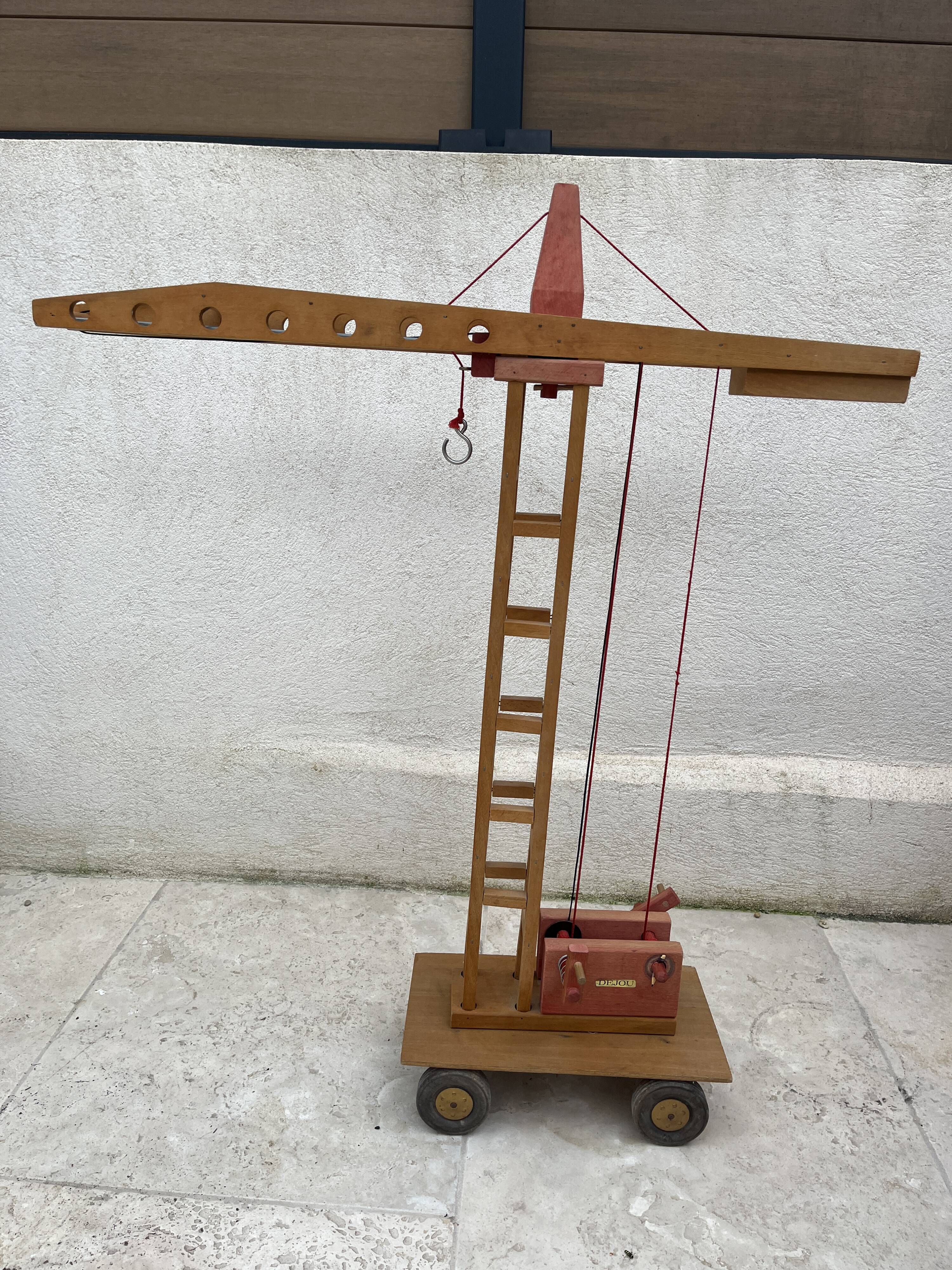 Vintage wooden crane toy from the 60s