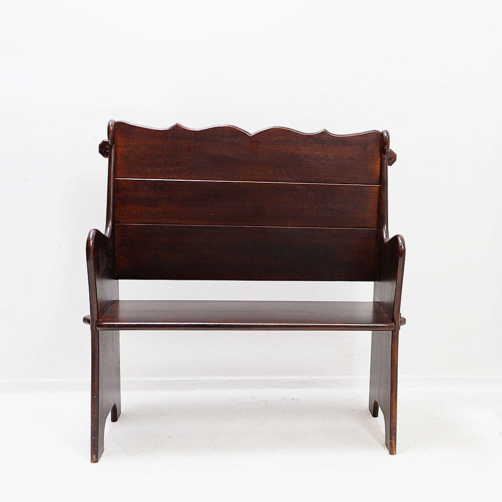 Vintage solid wood church bench from the 20th century.
