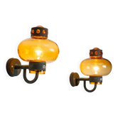 Pair of brass wall lamps with decorated amber coloured shades