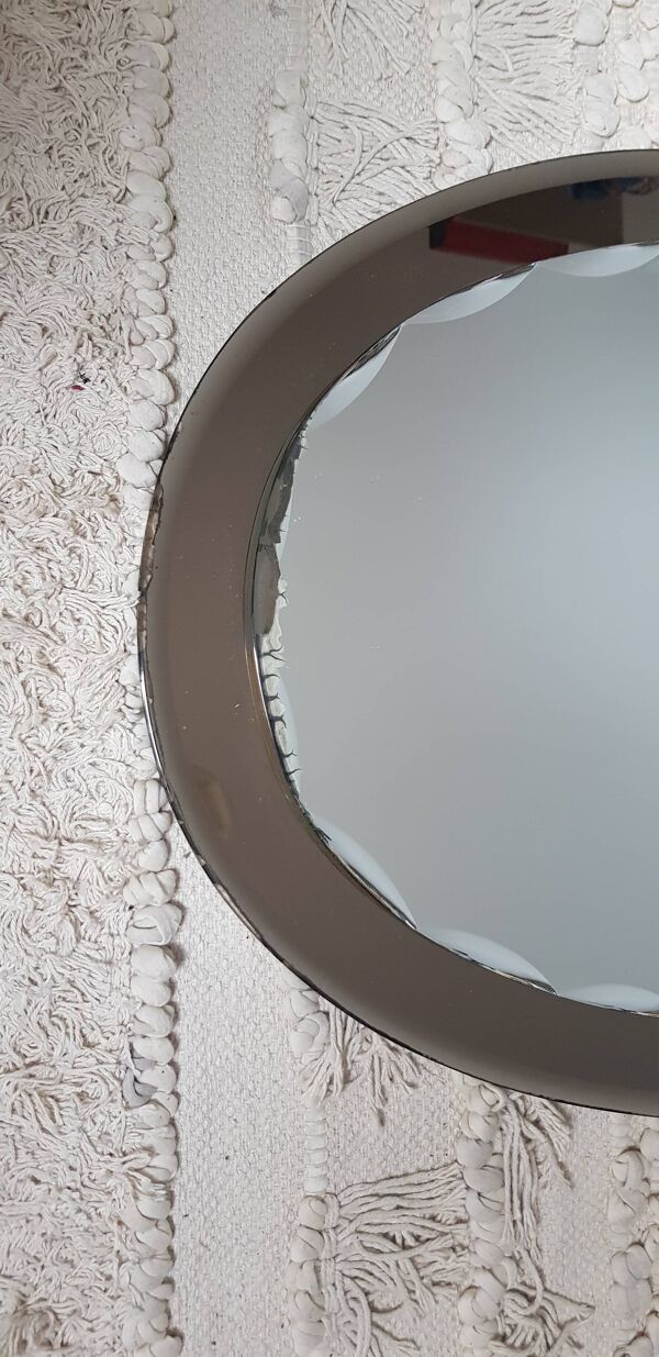 Miroir oval art deco un fond miroir fumé et un miroir par dessus biseauté 58x81cm