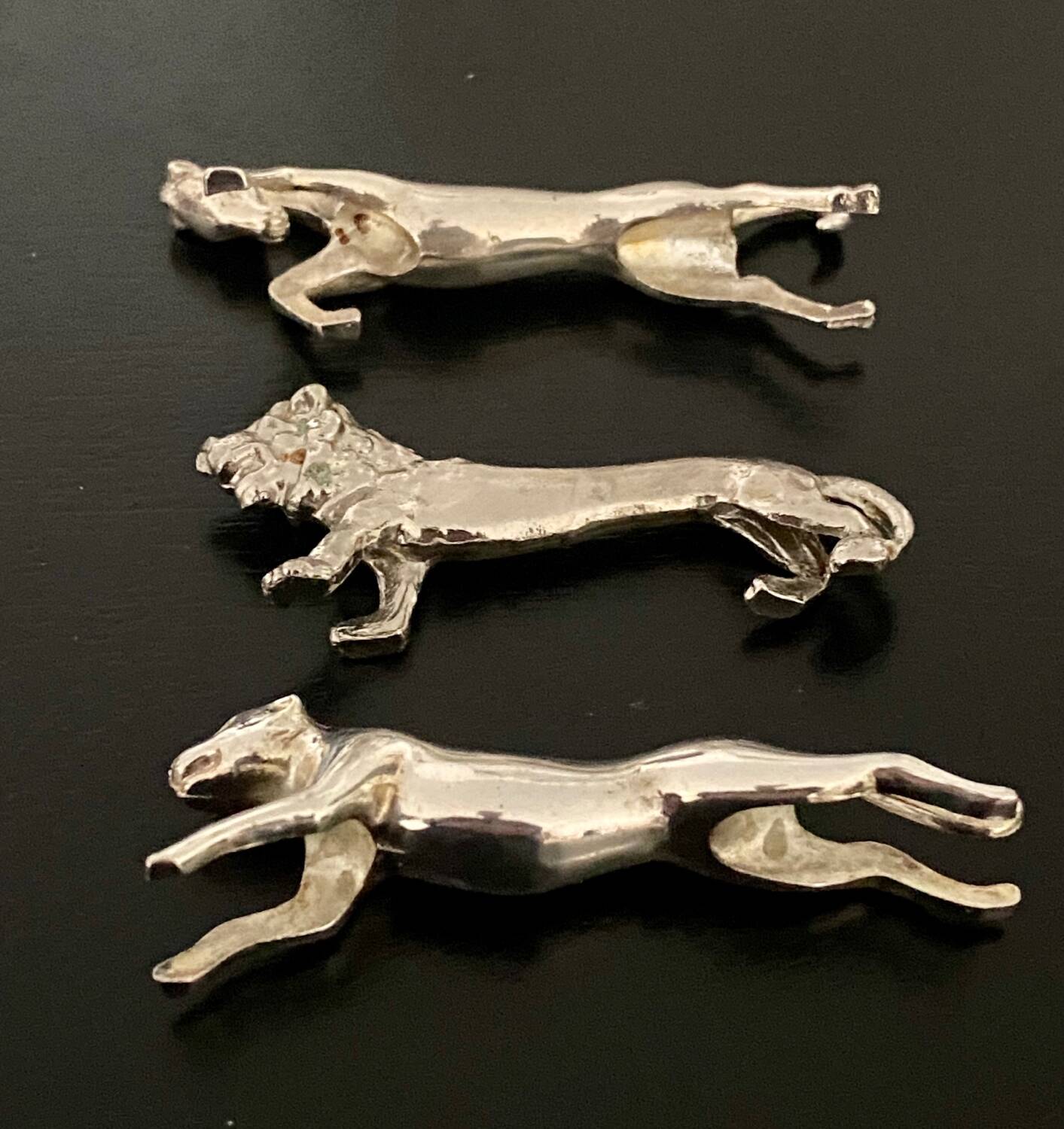 6 various animal shaped knife holders in silver metal