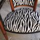Art deco armchair with zebra tapestry