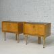 Pair of bedside tables in wood, brass and black glass top