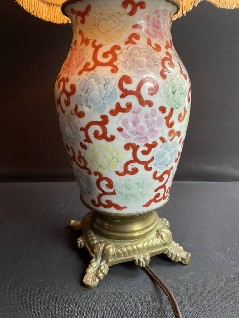 Old Asian vase mounted as a lamp with pagoda lampshade