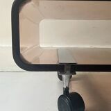 Smoked plexiglass coffee table on wheels, Roche Bobois design 1970.