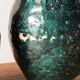 Set of two Chinese green glazed stoneware storage jars.