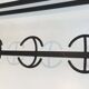 Designer coat rack in blackened metal