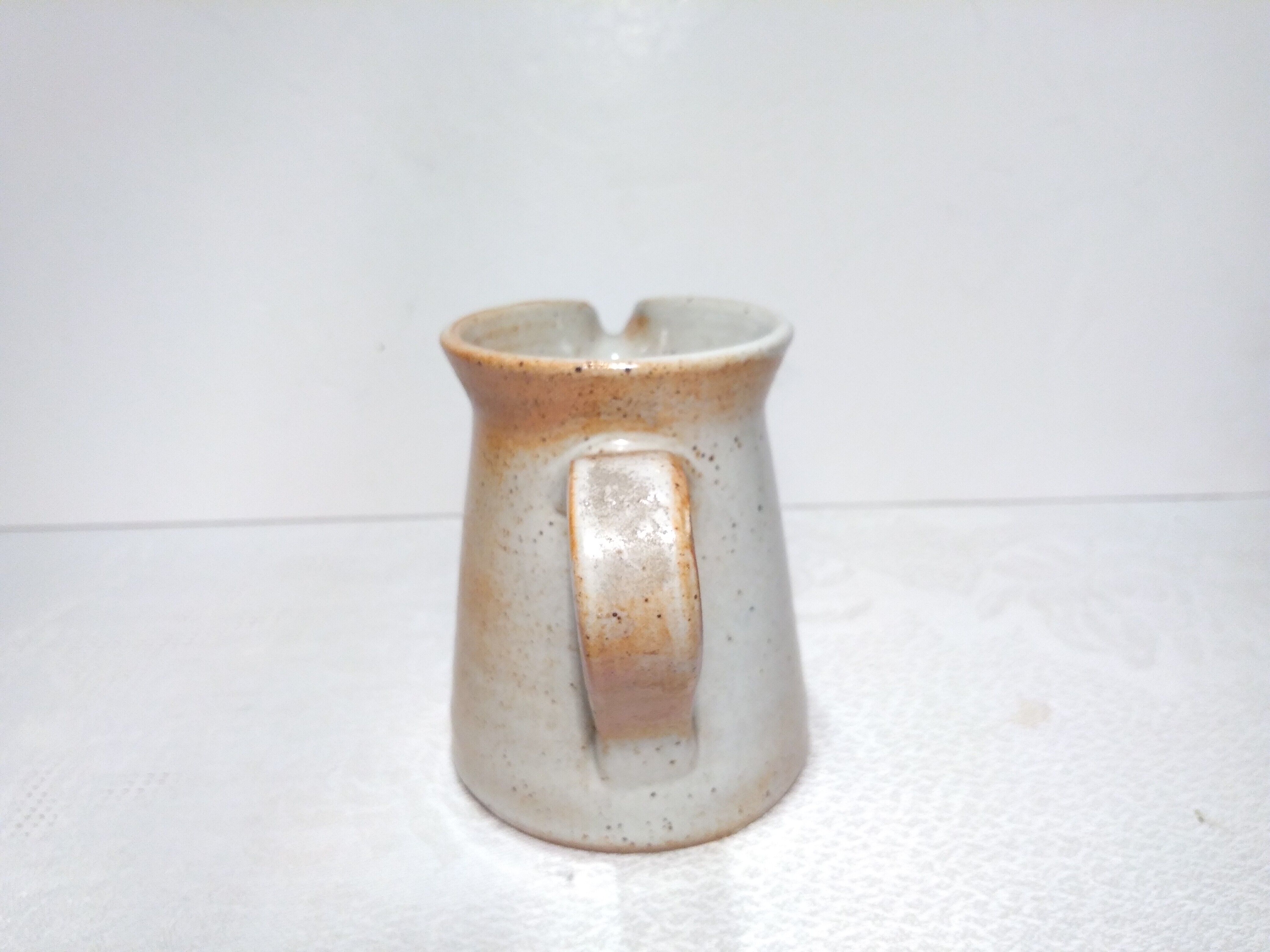 Vintage creamer in marsh sandstone