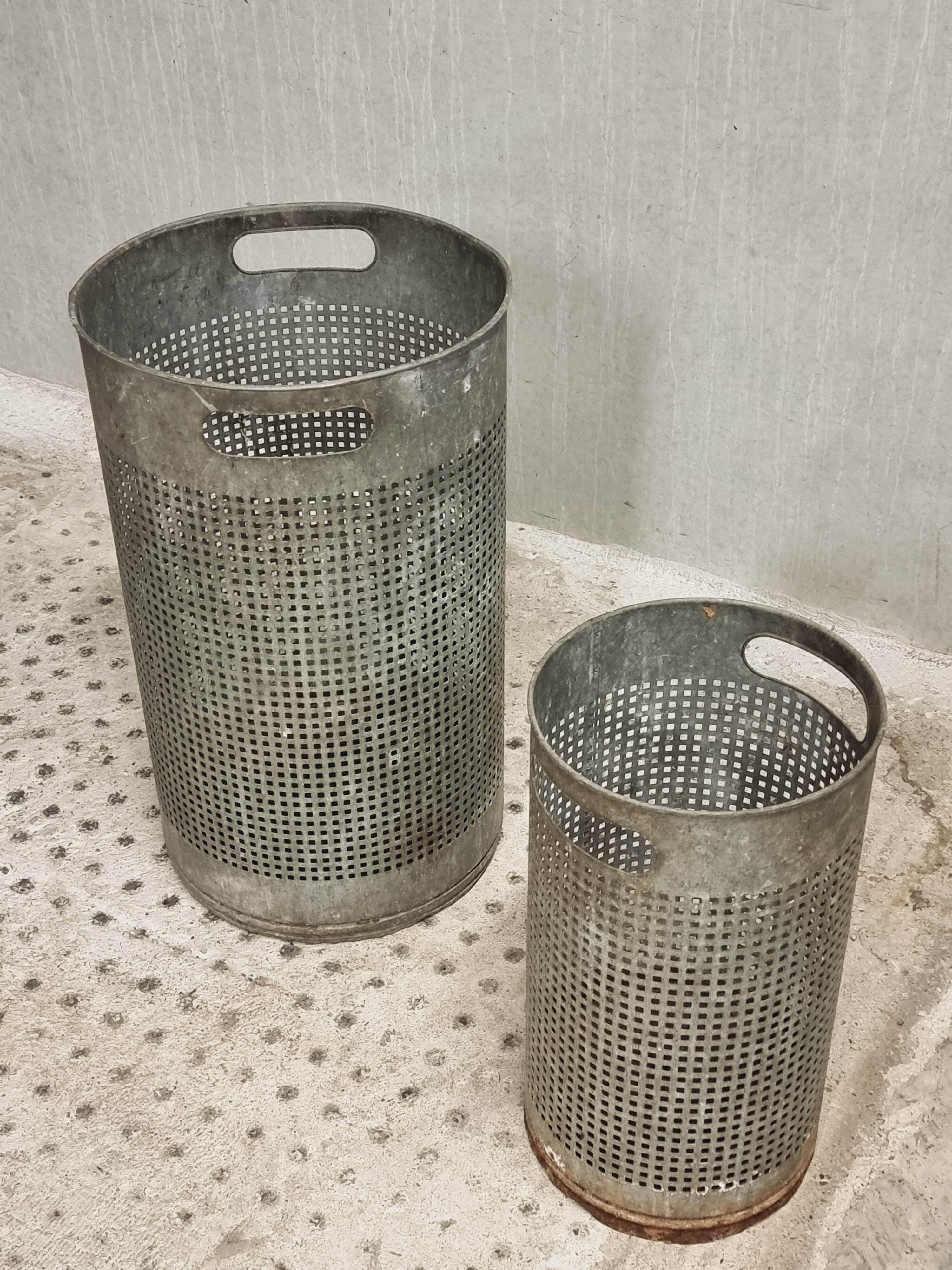 Vintage set of perforated metal waste bins