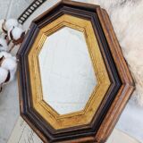 Antique mirror in black and gold octagonal wood