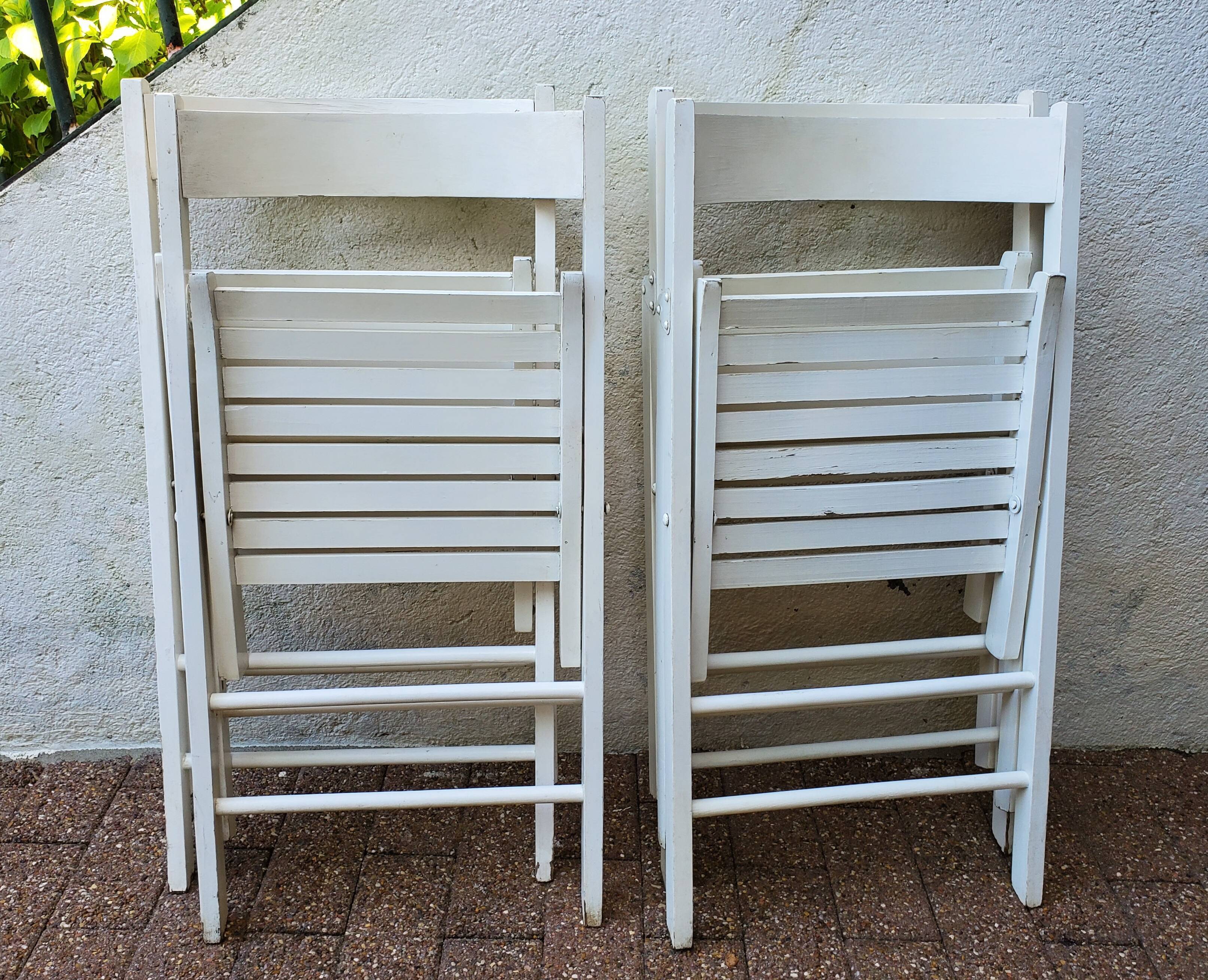 4 folding chairs made of 70's wood