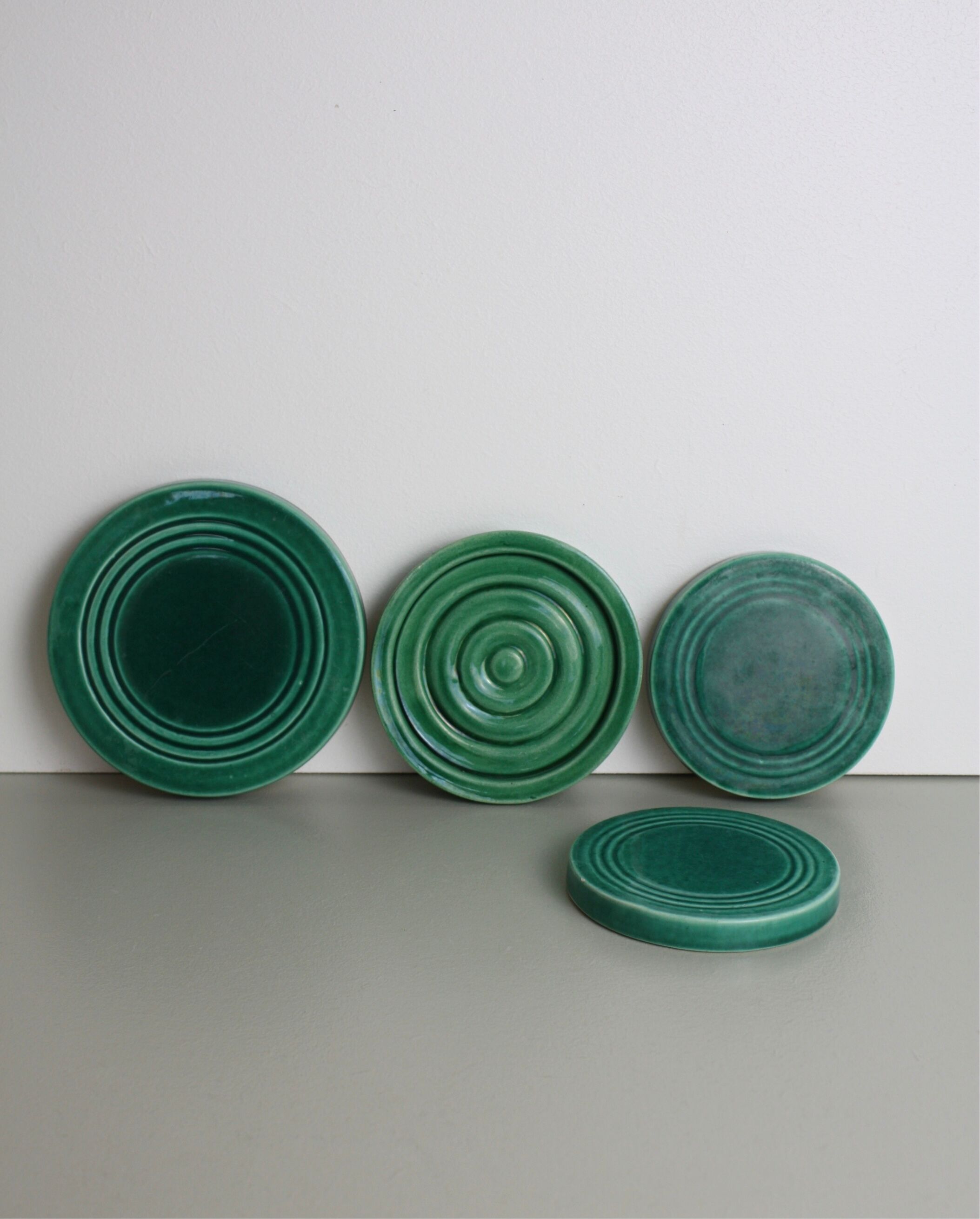 Set of 4 coasters in glass in green earthenware