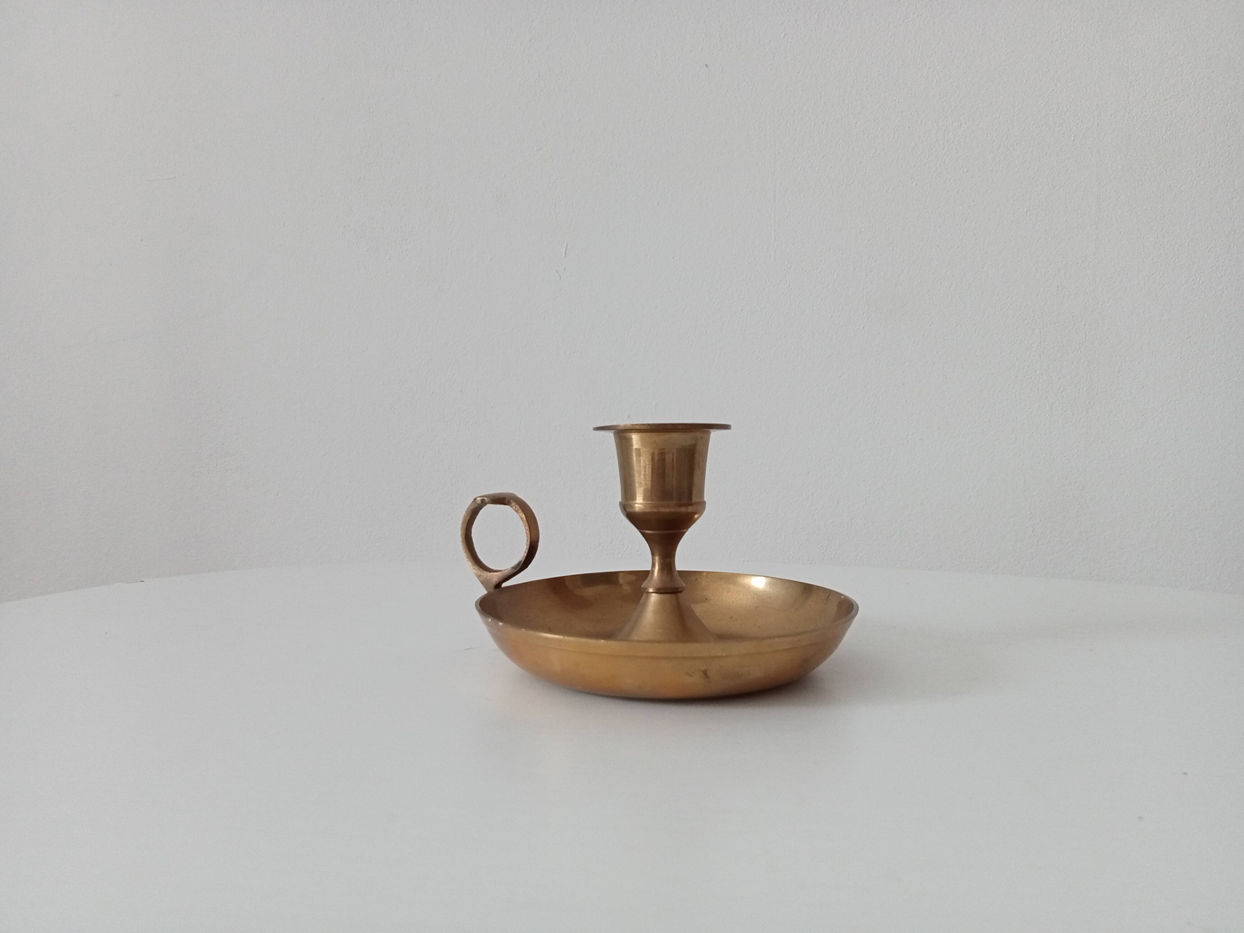 Vintage golden brass hand candle holder
