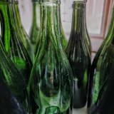 Old bottles in blown glass