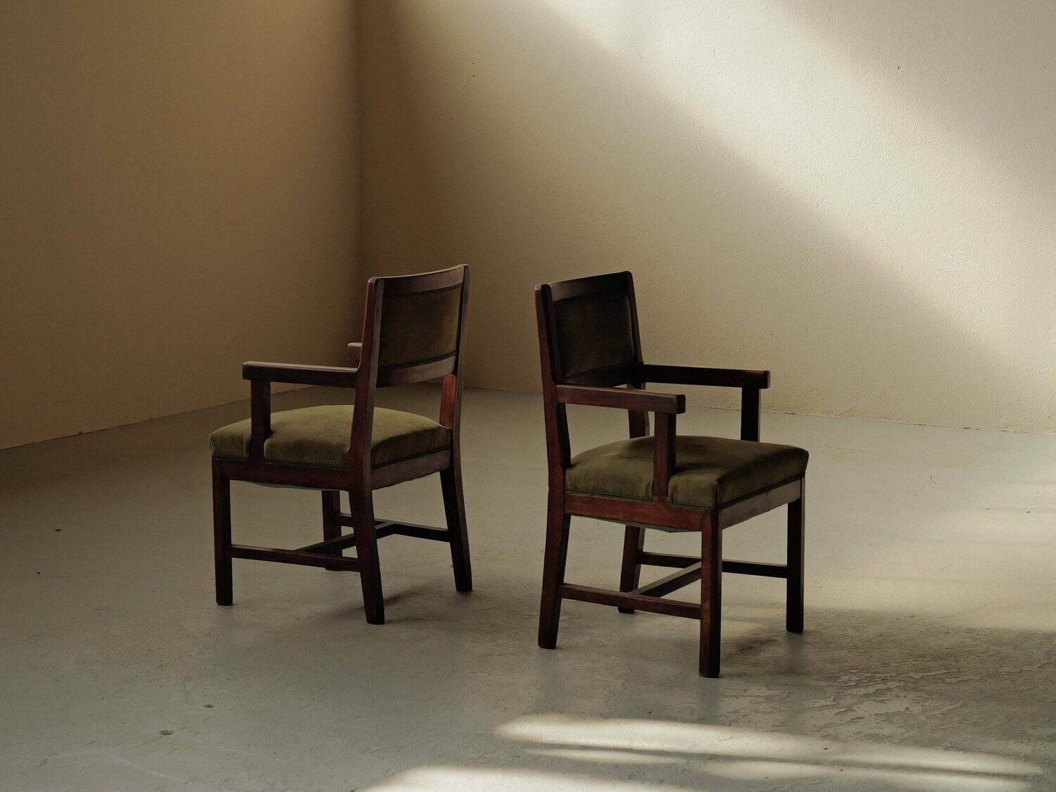 Pair of modernist armchairs in solid oak, France, circa 1940.