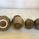 Eight brown ceramic pitcher vases