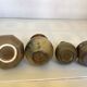 Eight brown ceramic pitcher vases