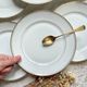 6 Small vintage French plates in golden white Limoges porcelain