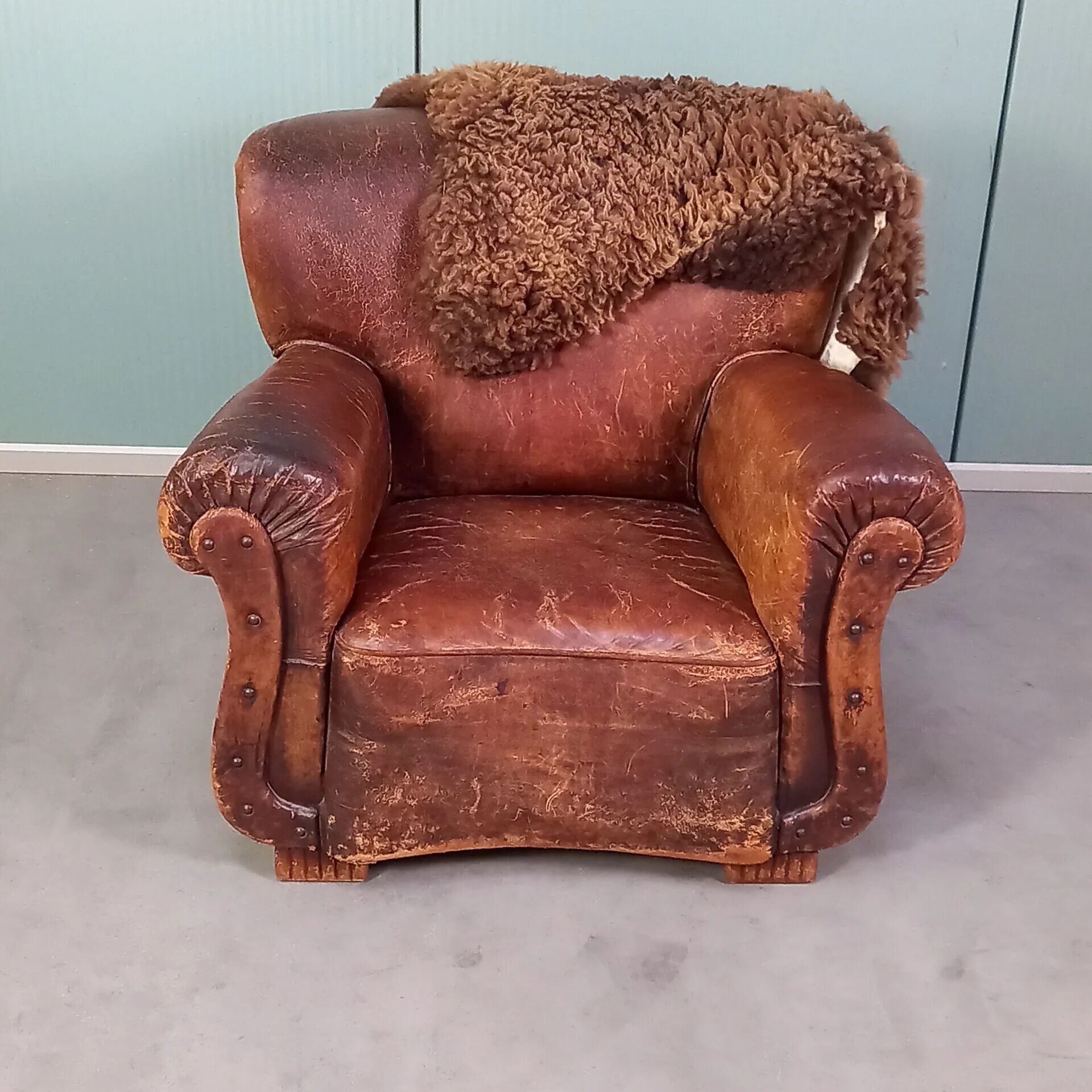 Leather nailed armchair