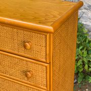 Dresser and its bedside table in rattan caning and vintage oak from the 1970s.