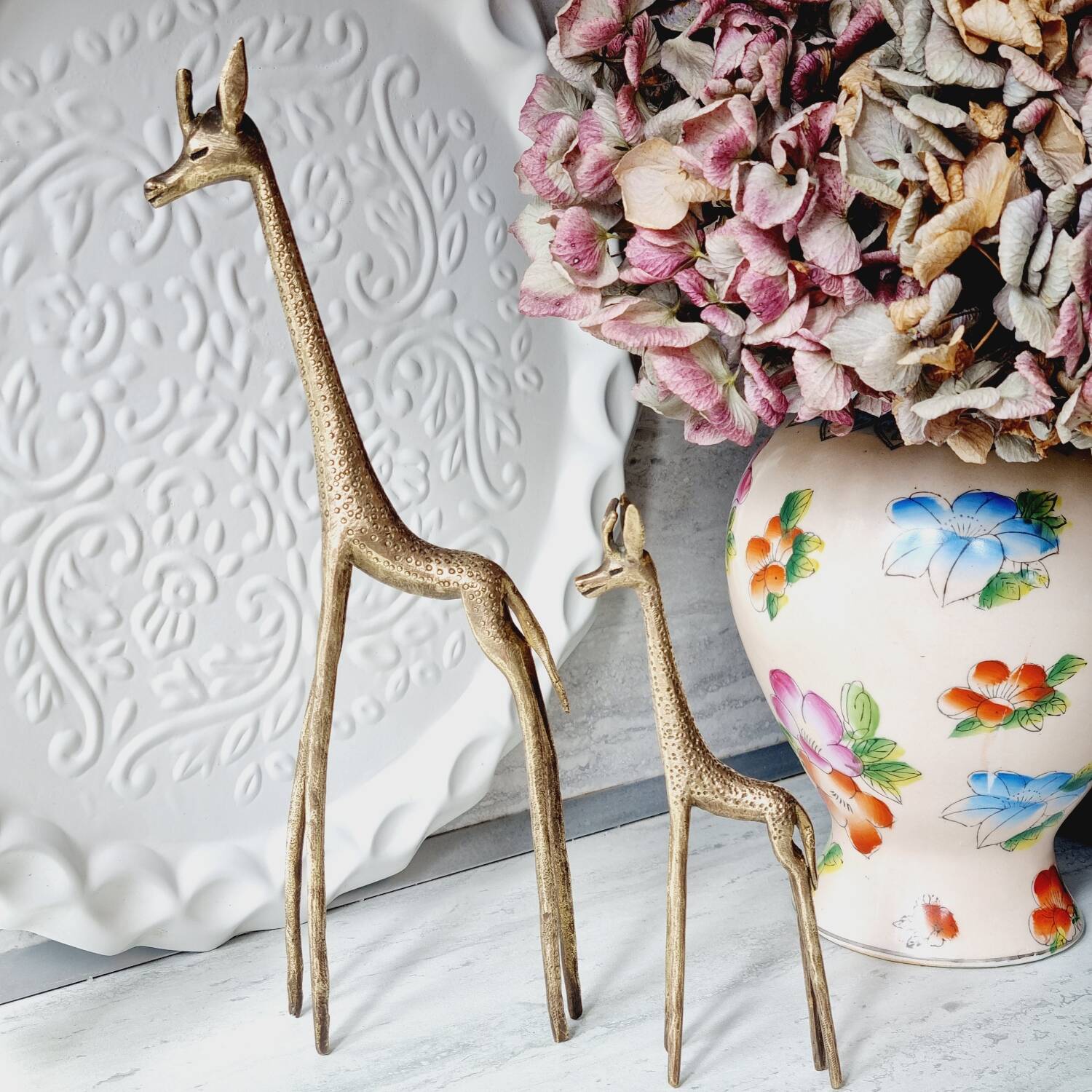 Stylized brass giraffes