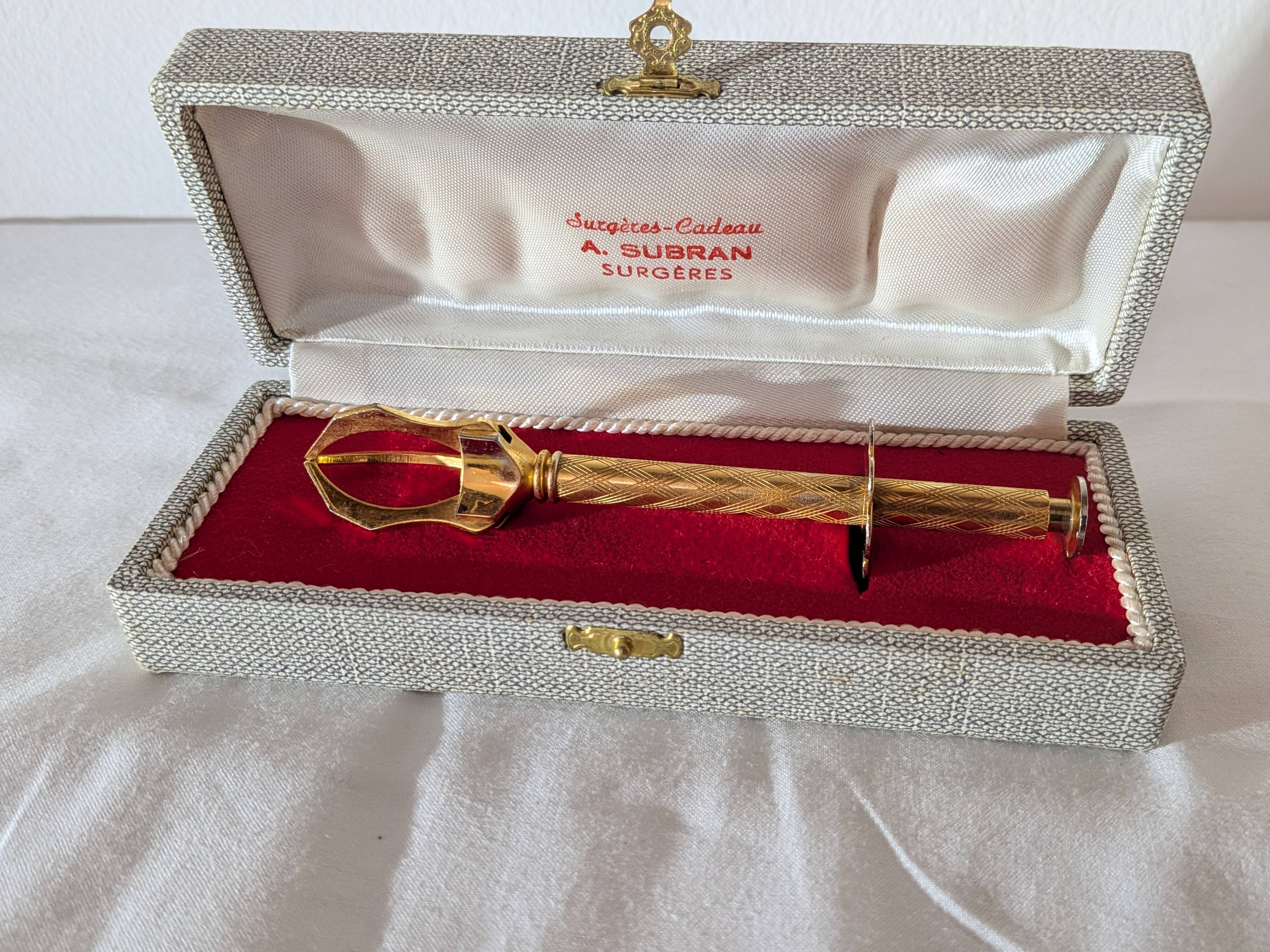 Vintage gold sugar tongs with case