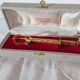 Vintage gold sugar tongs with case