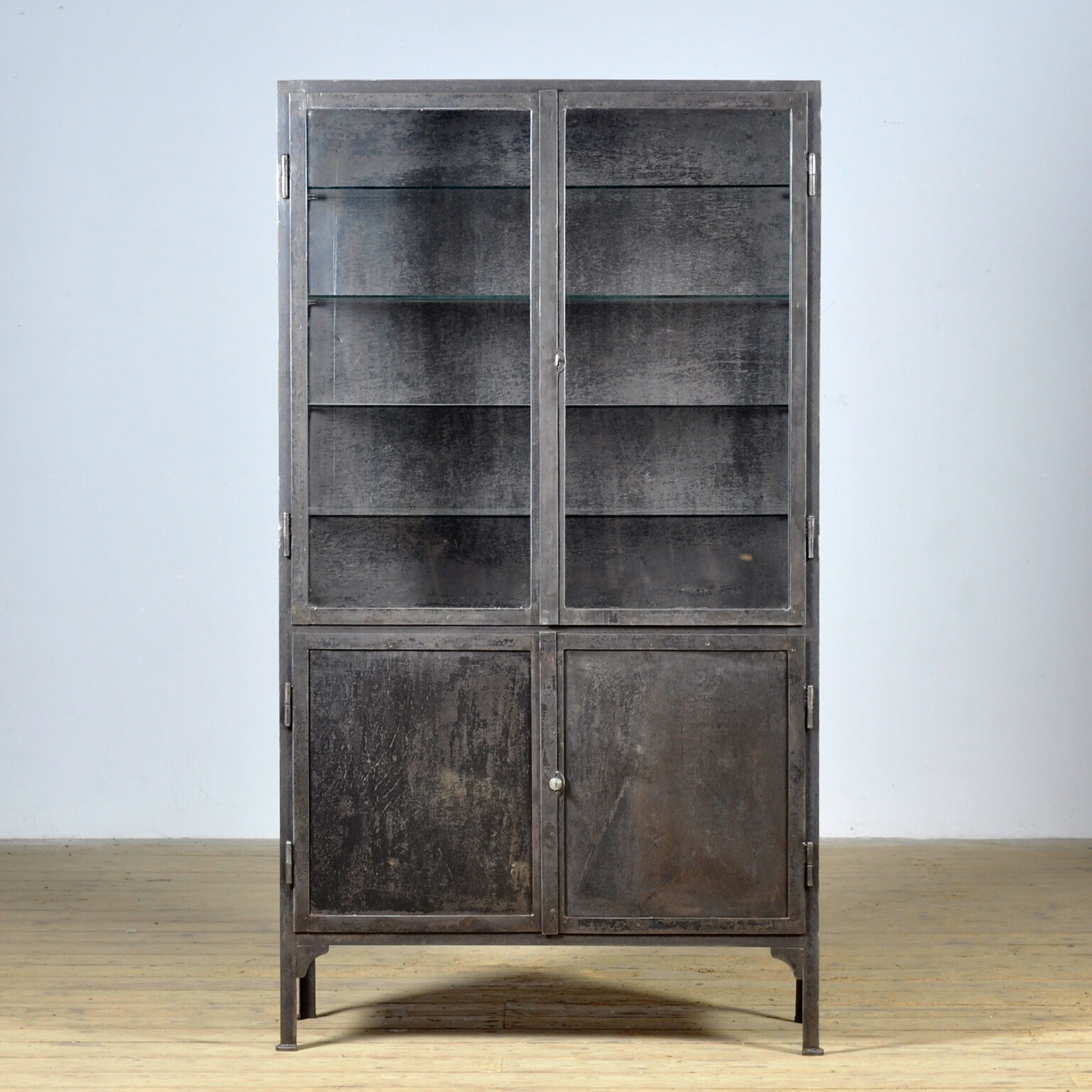 Polished iron medical cabinet, 1930s