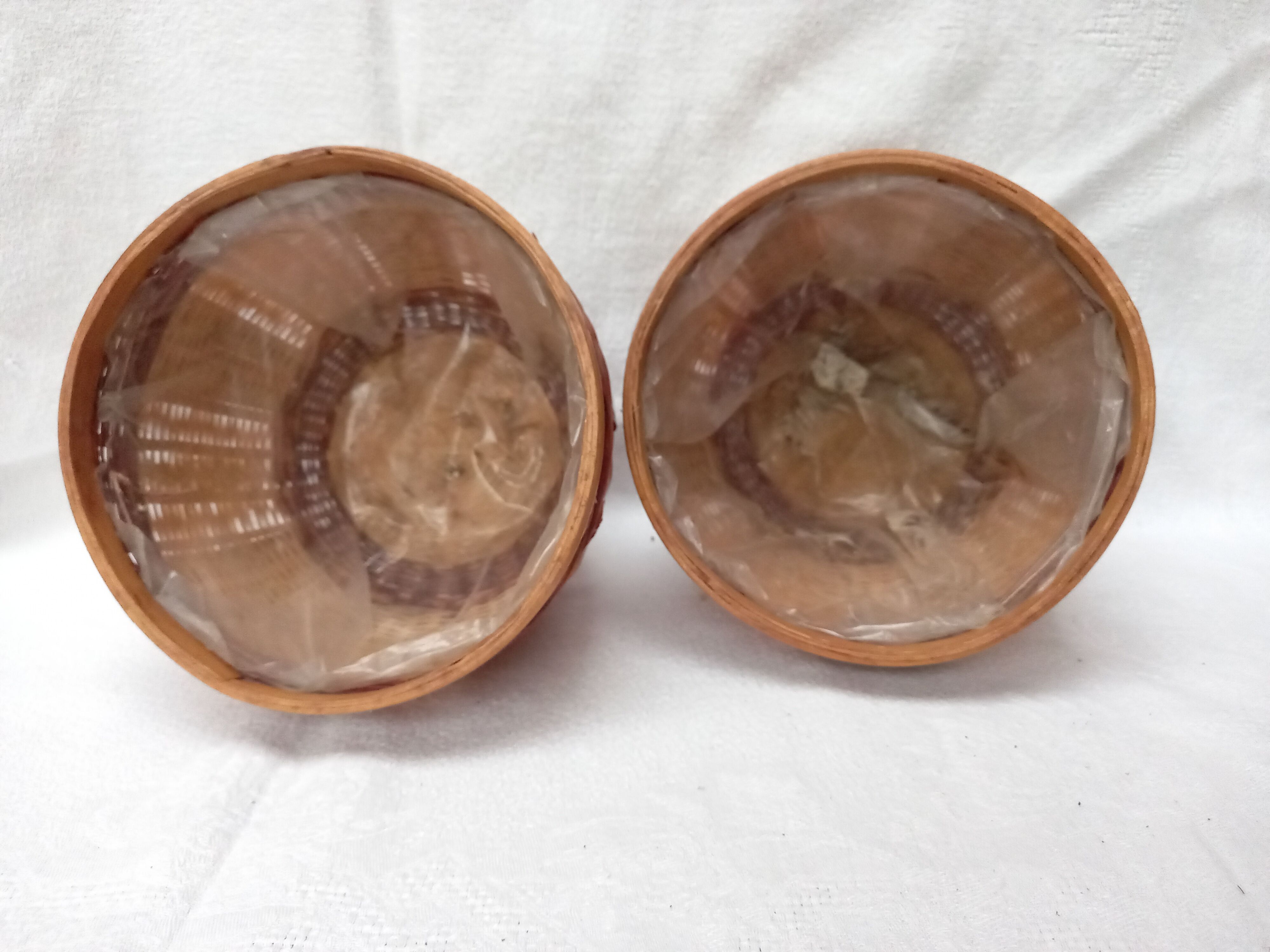 Duo of vintage braided wicker pot cover