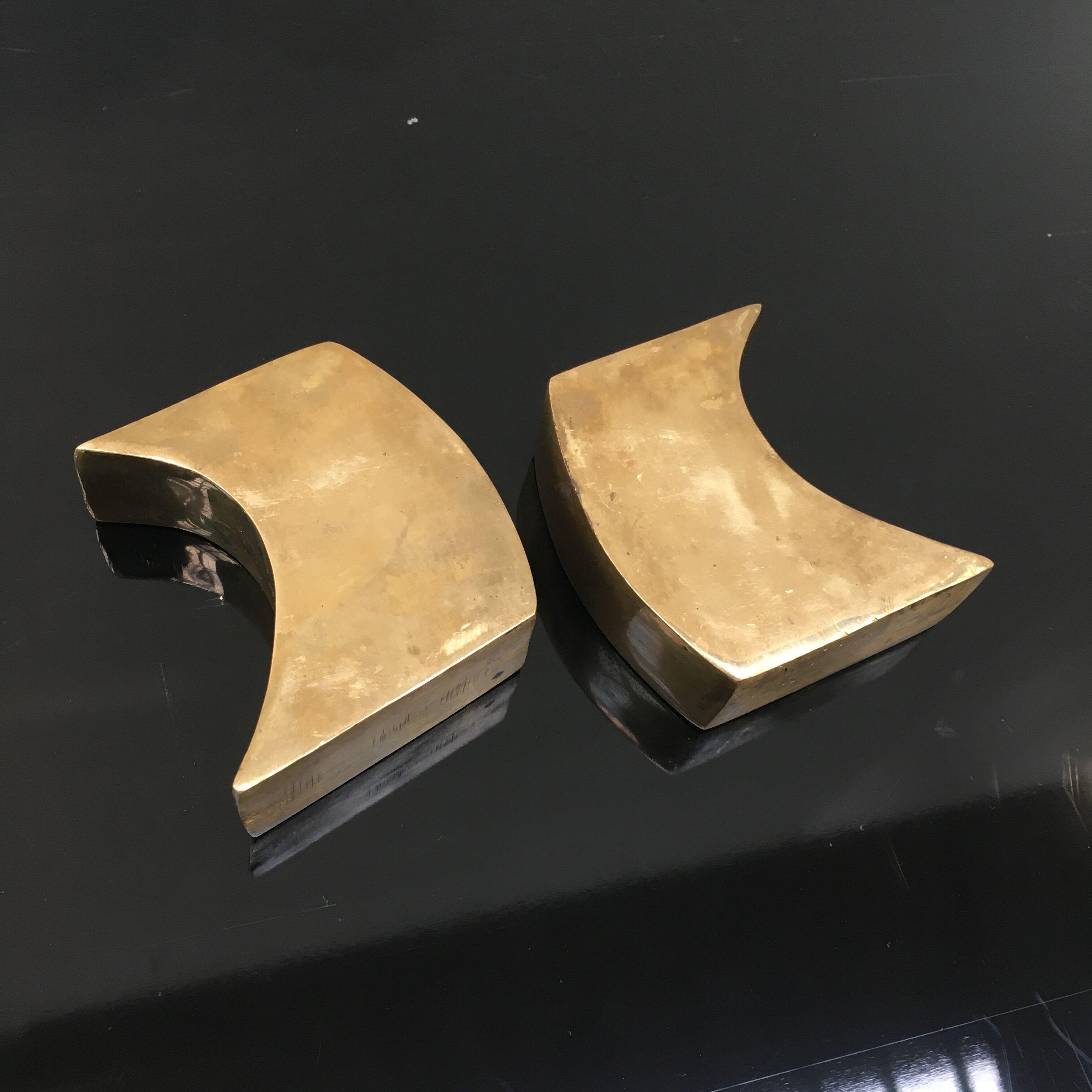 Pair of bronze candle holders by Monique Gerber