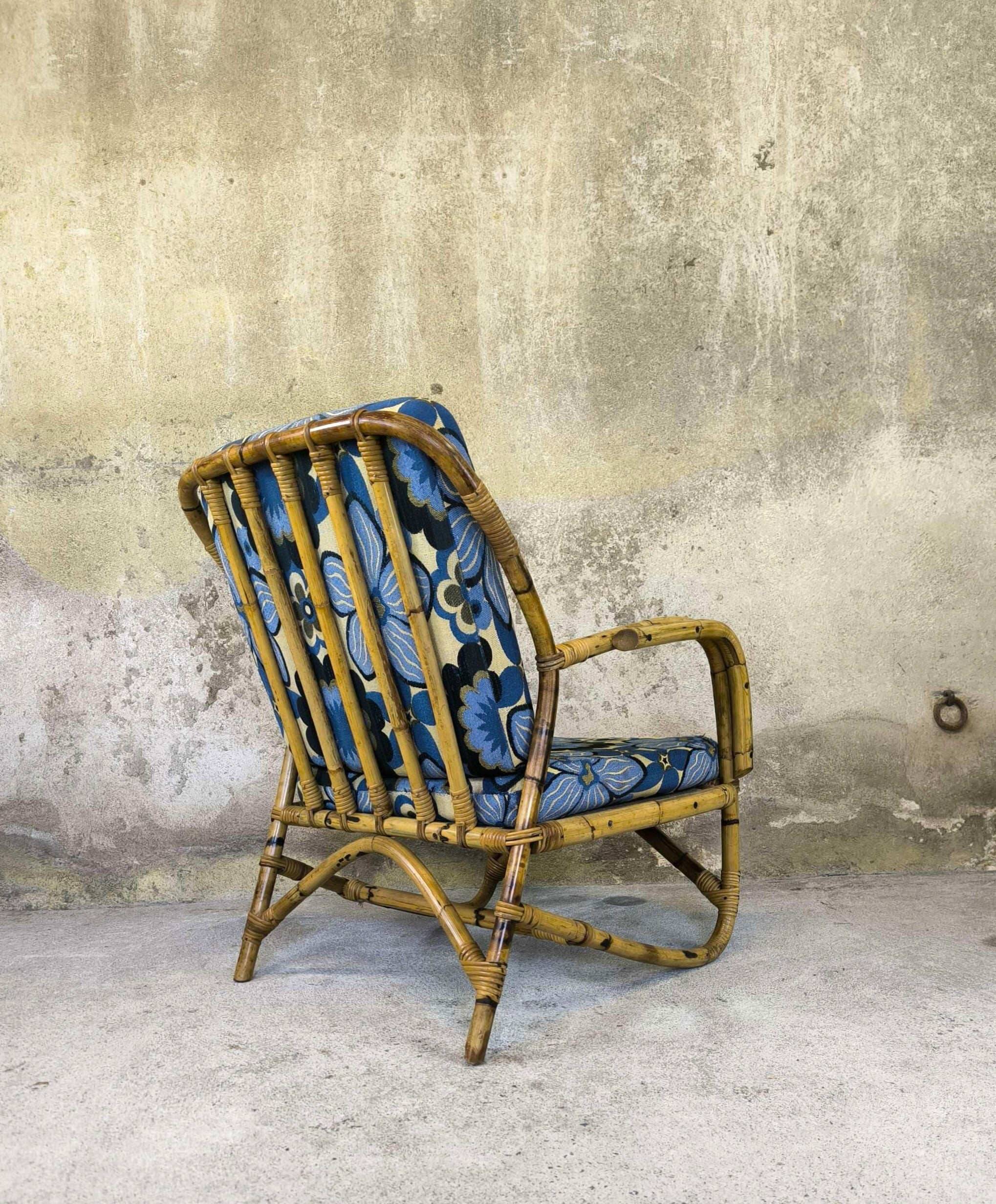 Vintage armchair in rattan and floral fabric
