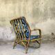 Fauteuil vintage en rotin et tissu à fleurs
