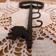 Old wall key holder in the shape of a vintage metal key 4 hooks