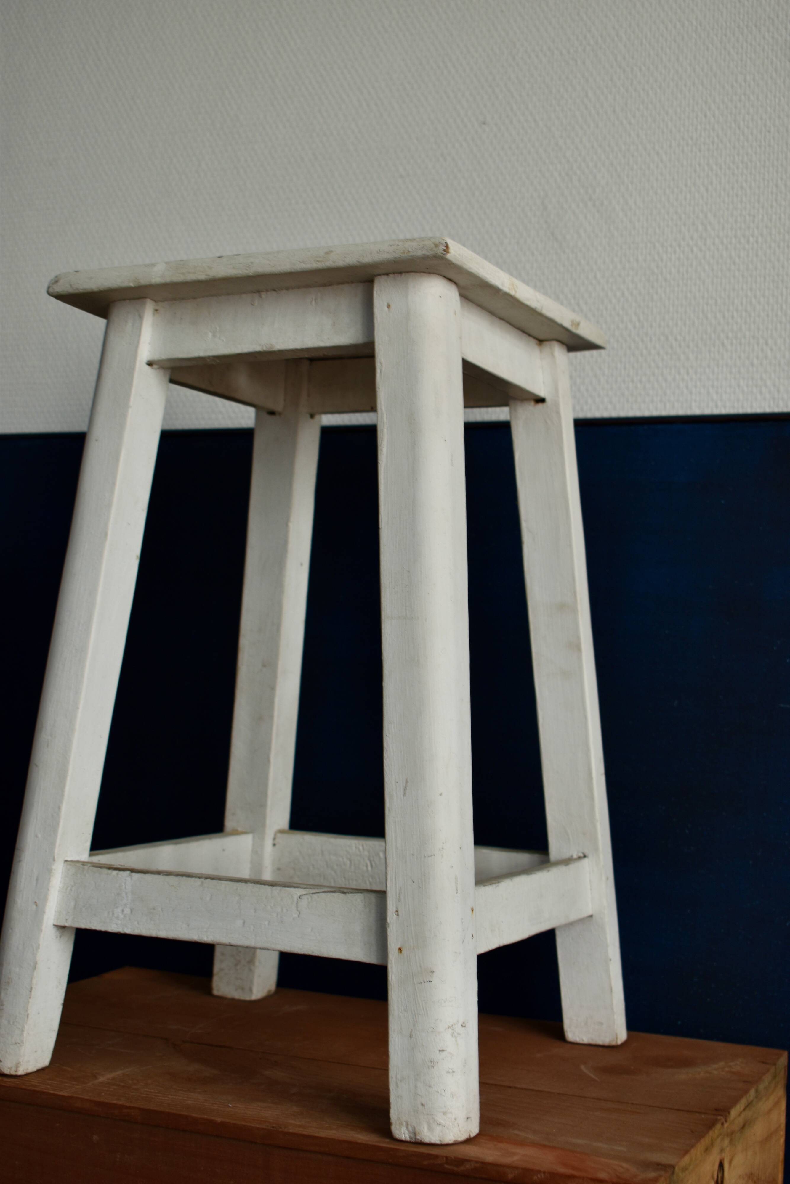 Old white wooden handle stool