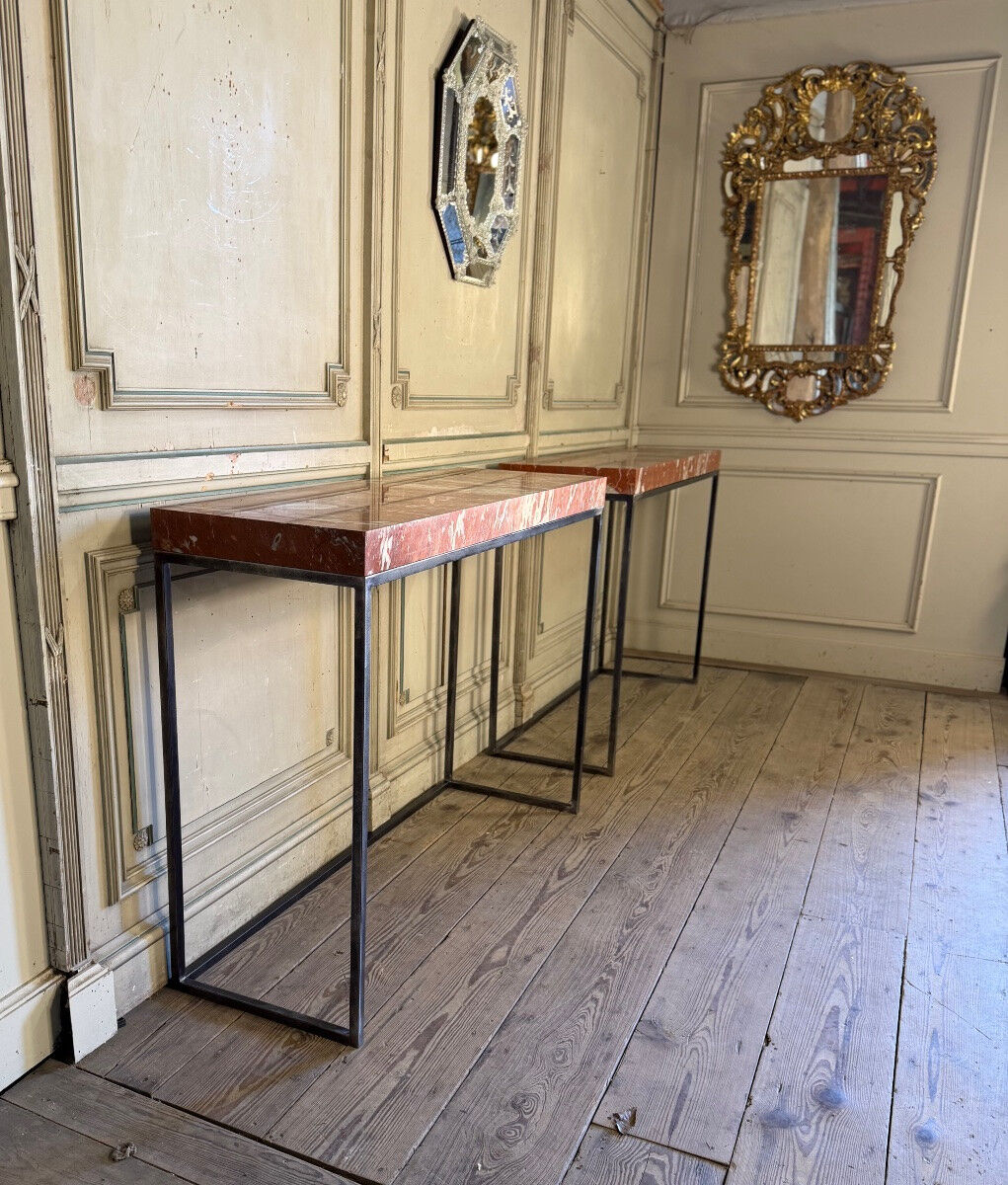 Pair of contemporary consoles in marble and metal.