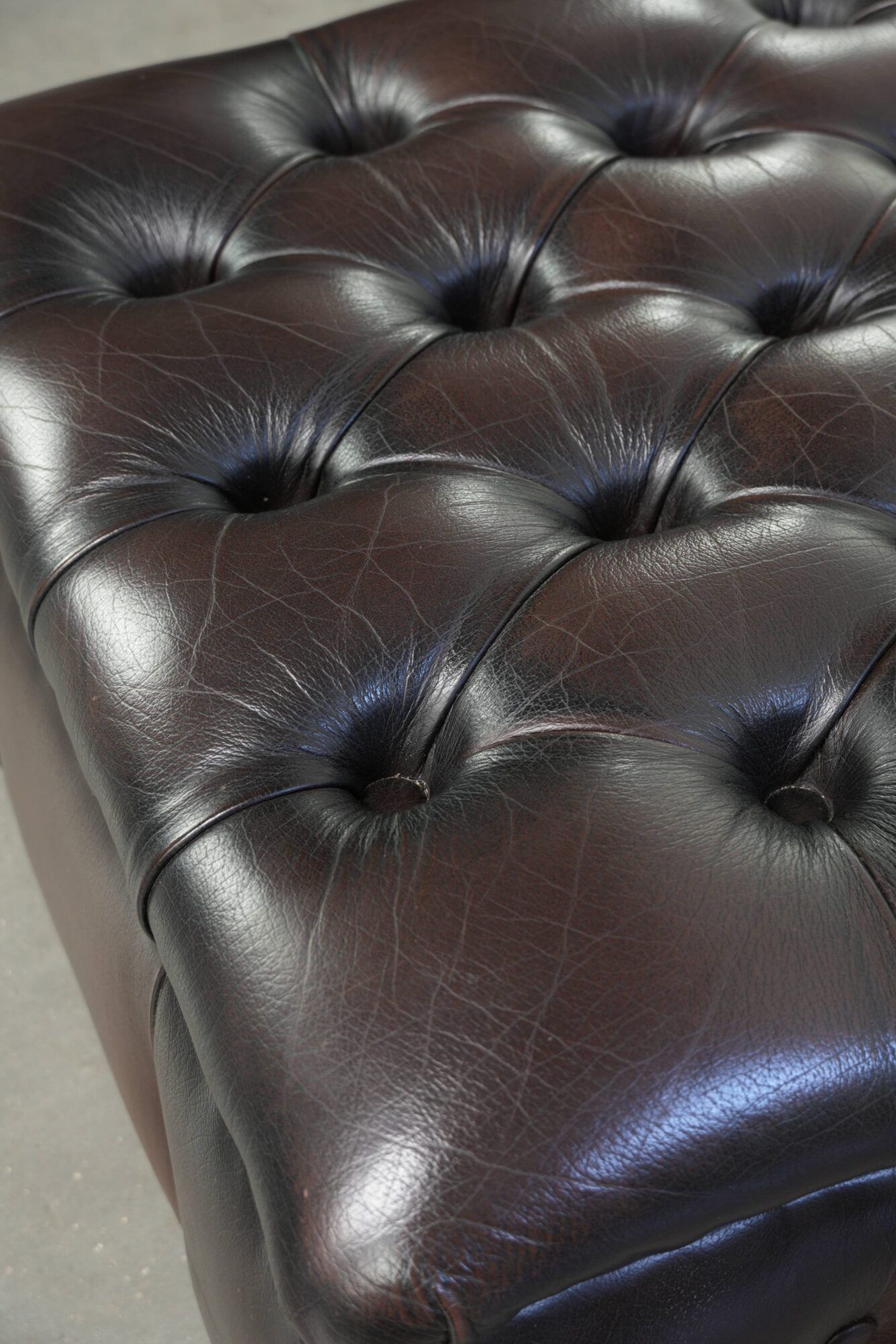 Cowhide Chesterfield ottoman with beautiful colours in English style