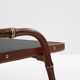 Jacques Adnet coffee table in red saddle-stitched leather and brass, 1950s