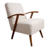 Vintage armchair in pearl bouclé, mid-century modern design from the 1960s.