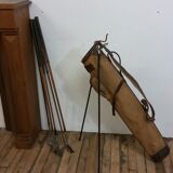 Old golf bag with 5 golf clubs