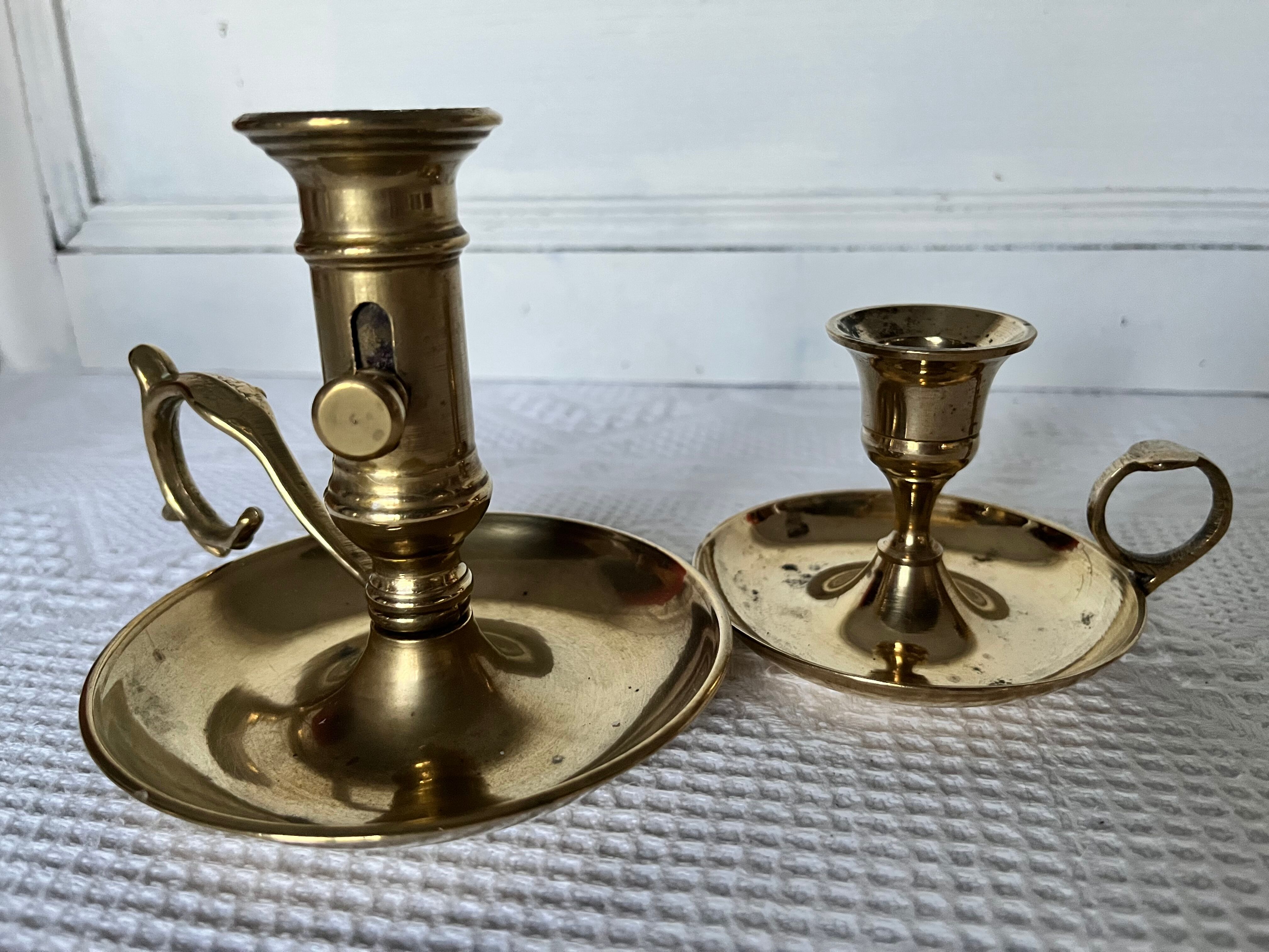 Duo of brass hand candle holders