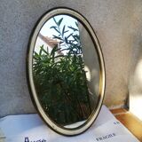 Old oval guilloche mirror, gilded and painted