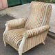 2 Louis XVI bergère armchairs in solid wood with beige and blue embroidered fabric.